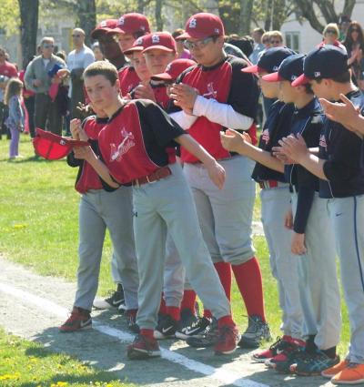 Luke Hanson tips his cap to players. For Hanson, along with 29 others, this is his final season playing little league. BY MATTHEW BERNAT