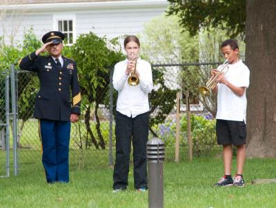 Meghan McCullough and John Kassabian, members of the Old Hammondtown School band, play taps. BY GEORGIA SPARLING