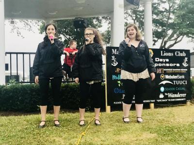 Showstoppers Laura Perreira, left, Brianna Lynch, and Emma Whynacht, performed as a trio at the "Taste of the Town" food festival in Shipyard Park. BY CHRIS REAGLE