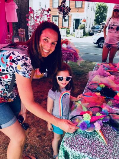 Sara Couto, of Fairhaven, and her daughter, Lydia, 5, share some fun time last Saturday shopping in the "Ooh So Tulle" booth at Harbor Days. BY CHRIS REAGLE