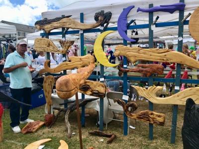Marc LeBlanc, of Dennis, sold his nautical and celestial wood creations Saturday in the vendor booth area at harbor Days. BY CHRIS REAGLE