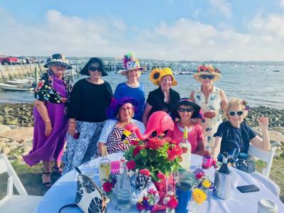 The ladies at this table chose a hat theme. Pictured are, from left, Sandy McGowan, Sue Cusic, Liz Waring, Sally Westgate, Joan DeRugeris, Pat Boss, Judy DeMailly, and Joanne Dunn. BY CHRIS REAGLE