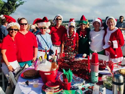 It was Christmas in August for, from the left, Denise Belanger, Mary Lyons, Bette Tripp, Chris Cochas, Lisa Thibeault, Nicki Demaskis, Marcia Mitchell, and Pat Harrington. BY CHRIS REAGLE