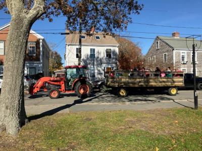 Bruce Rocha drove the tractor for the hay rides and made 11 trips throughout the afternoon. Photo Courtesy: Mattapoisett Lions Club