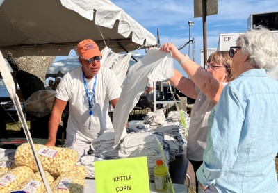 Michael Rosa passes out Harbor Days t-shirts, designed by Finn Pereira from Old Colony Regional Vocational Technical High School. The design had such great feedback that the Lions Club used it on the program, too.