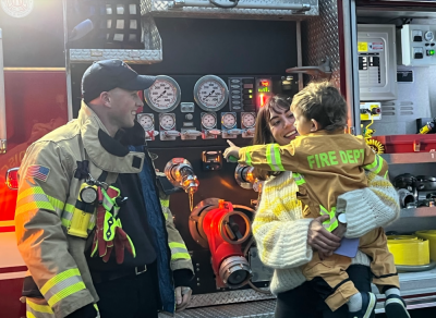 Leo Smith’s firefighter costume got the attention of Mattapoisett firefighter Brett Gauvin, who showed him the truck. Photo by: Gillian English