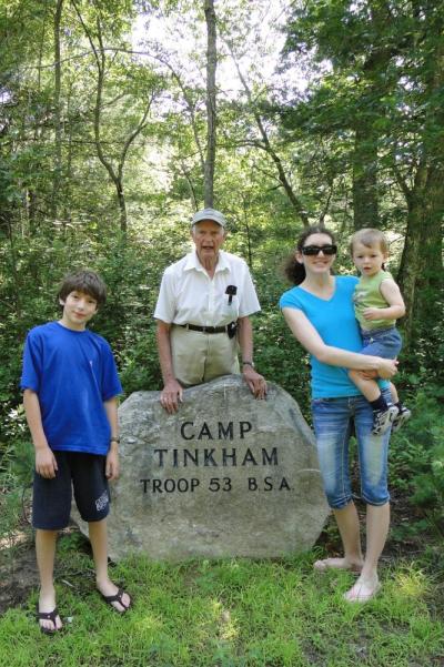 Tinkham gave 5 acres of land to local Boy Scouts. He stands at that spot with his grandchildren. Photo courtesy: Cheryl Baum