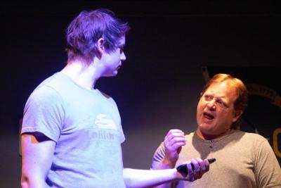 Senator Charlie Whitmore (Garrett Olson), right, speaks “off-the-cuff” when interviewed by a conservative blogger (Oliver Asker).