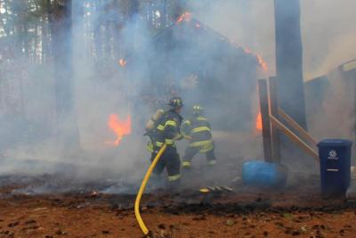 Firefighters contain the blaze at Camp Hadley on Wednesday, March 8. Photo courtesy: Marion Police Department Facebook.