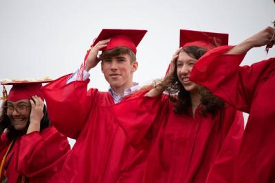 The wind didn’t stop graduating seniors from enjoying their moment in the spotlight. Photo by: Sawyer Smook-Pollitt
