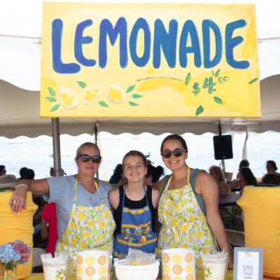 From left to right: Catherine Renzi, Chase Renzi, 14, and Chelsea Eby sell lemonade at Harbor Days on Sunday, July 21. Photo by Sawyer Smook-Pollitt