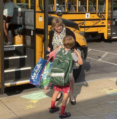 Rochester Memorial School Principal Heidi Letendre says hello to a student. Photo by Brendan Cassidy