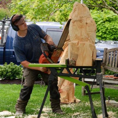Chainsaw artist Evan Verissimo of Acushnet-based Kind Tree Carving presented May 18 outside the Marion Art Center as part of the ArtWeek SouthCoast festival. Photo by Erez Ben-Akiva