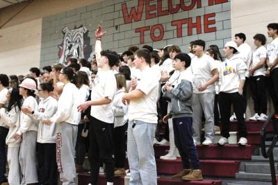 Old Rochester’s fan section roars in approval as the team gains a 16-point lead in the first quarter.