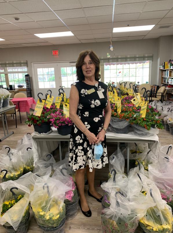 Sippican Healthcare Center Administrator Karen Lee Wadlow with some of the flowers that were delivered to the nursing and rehabilitation center.  Photo courtesy: Sippican Healthcare Center
