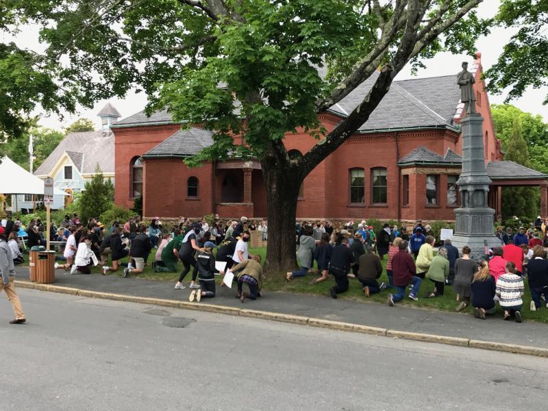 Protestors along the side of the Music Hall. Photo by: Hollie Danhauser