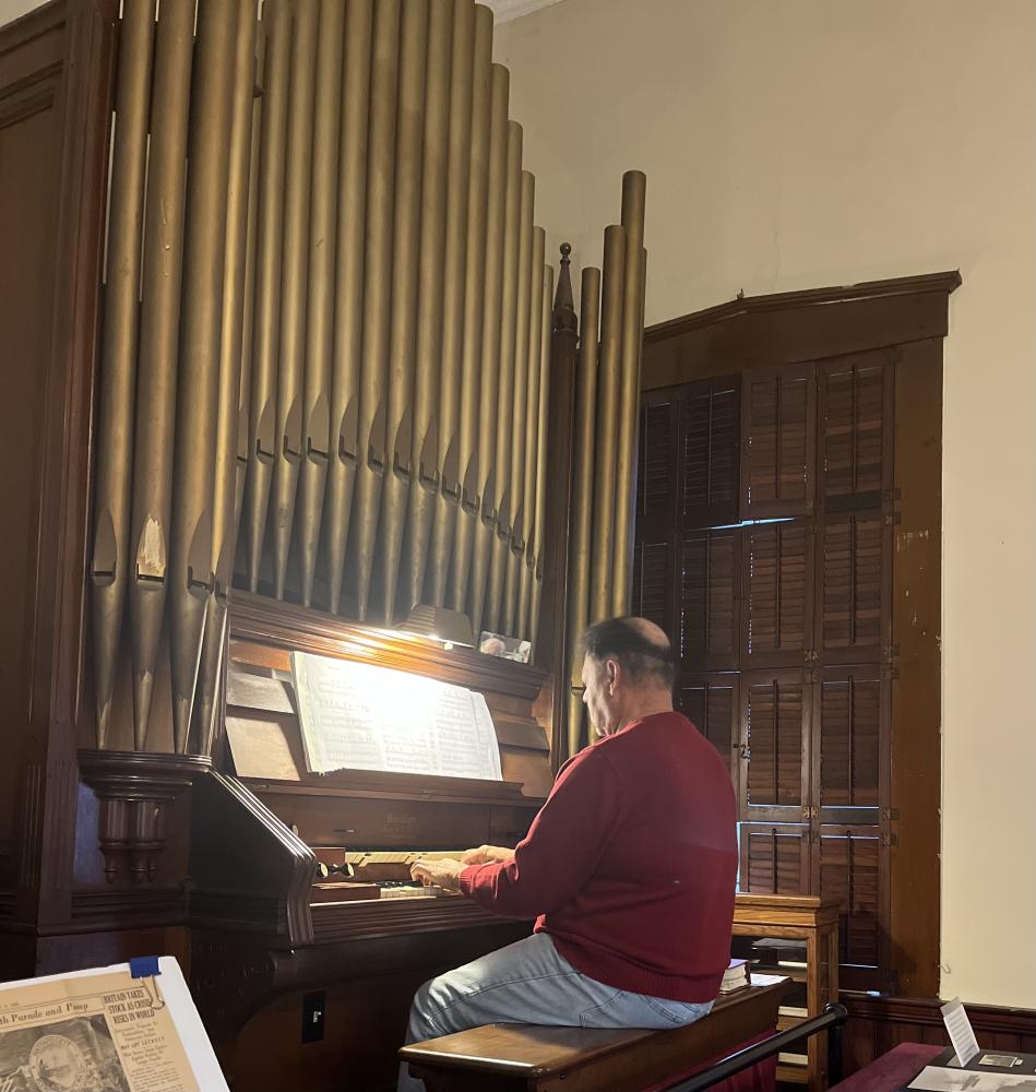 Gardzina playing the 127 year old organ. Photos by: Taylor Fruzzetti