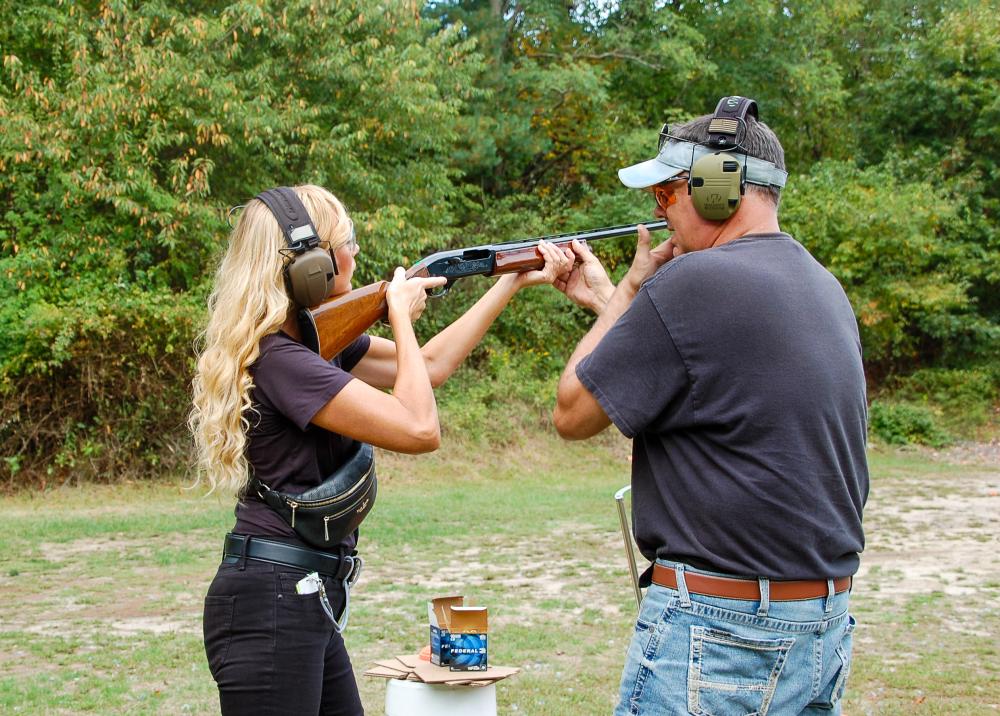 Particpant lines up to shoot a clay pidgeon at the shotgun range. Particpant lines up to shoot a clay pidgeon at the shotgun range.