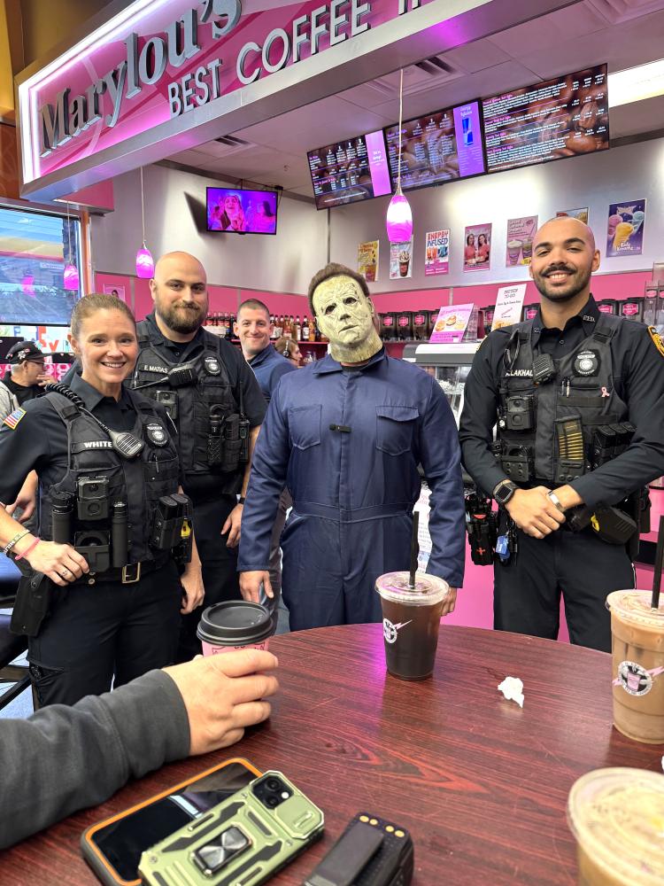 Officer Catilin White, Officer Emmanuel Matias, Sergeant Connor Ledin and Officer Amin Alkahal connect with the Rochester Community at Mary Lou's Coffee, alongside "Halloween" villain Michael Myers. Source: Rochester Police Department Officer Catilin White, Officer Emmanuel Matias, Sergeant Connor Ledin and Officer Amin Alkahal connect with the Rochester Community at Mary Lou's Coffee, alongside "Halloween" villain Michael Myers. Source: Rochester Police Department