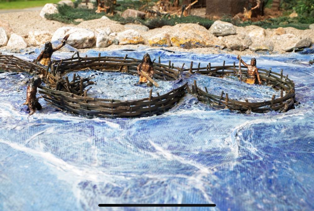 Men working on a fish weir at the mouth of the Mattapoisett River in the Museum's diorama depicting what the Wampanoag village of Mattapoisett may have looked like 2,000-3,000 years ago. Source Phil Mello