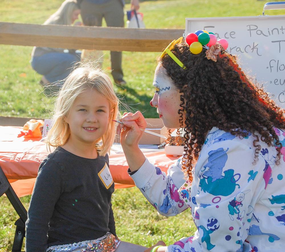 Lilly Bowser, age 5, gets her face painted. Lilly Bowser, age 5, gets her face painted.
