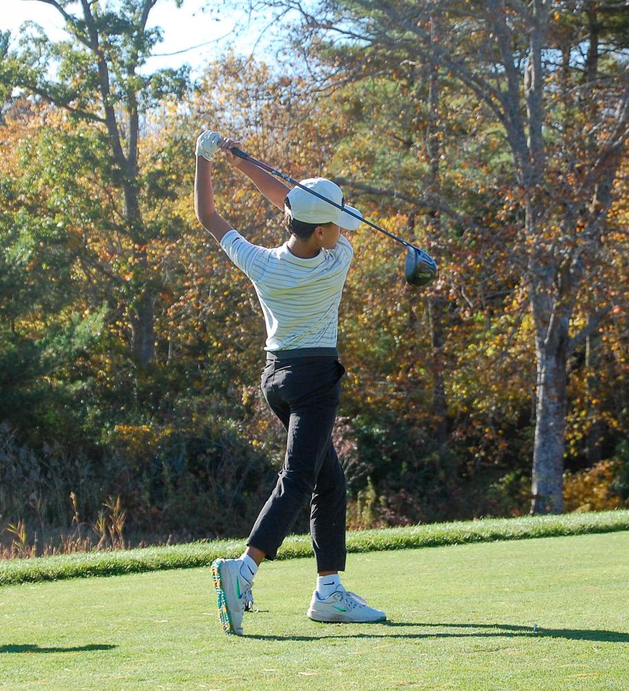 John Bongiorno finishes a swing. John Bongiorno finishes a swing.