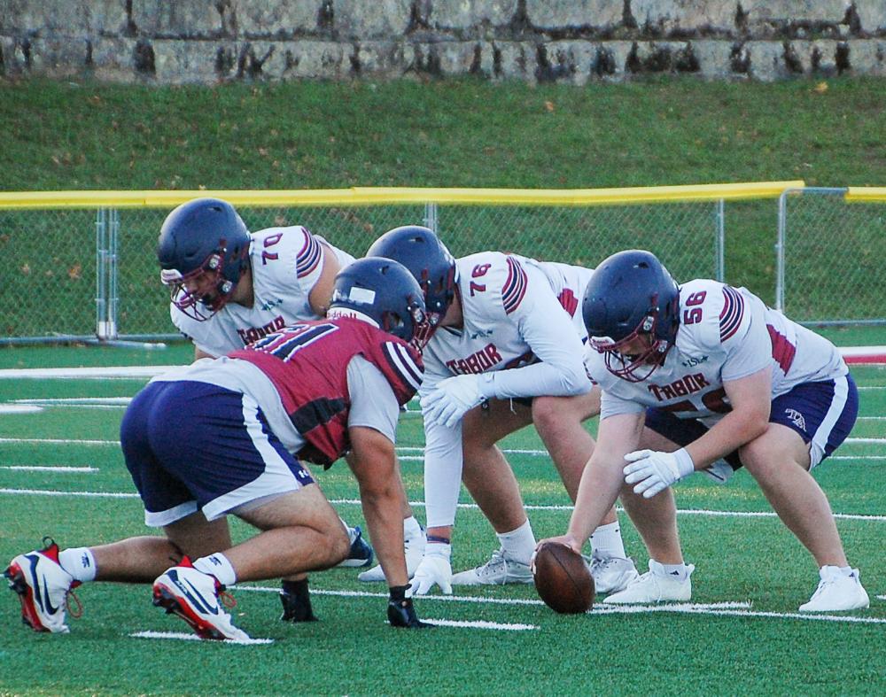 The offensive line looks to protect Bourque. The offensive line looks to protect Bourque.