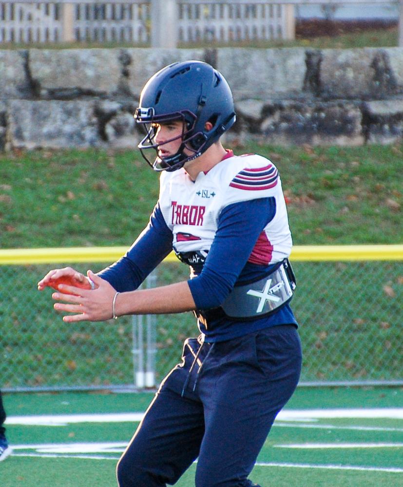 Peter Bourque, quarterback, waits for a snap. Photos by Mari Huglin Peter Bourque, quarterback, waits for a snap. Photos by Mari Huglin
