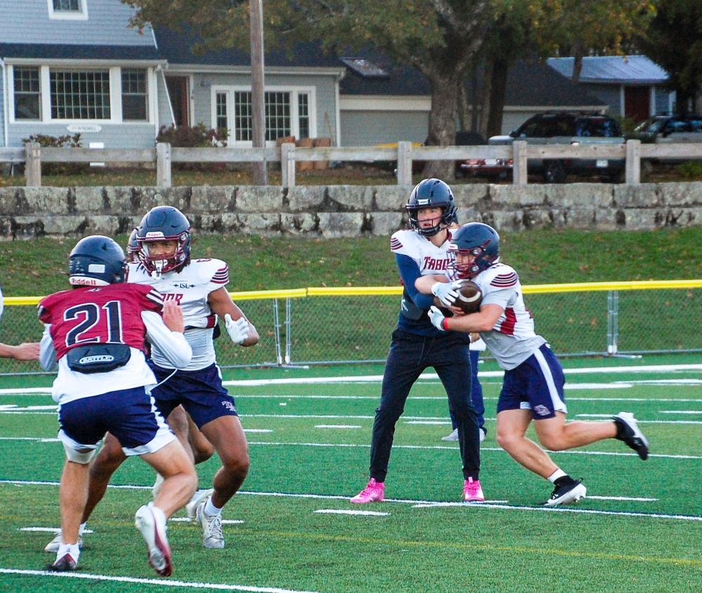 Bourque passes the ball to Lucas Fickeisen for a run play. Bourque passes the ball to Lucas Fickeisen for a run play.