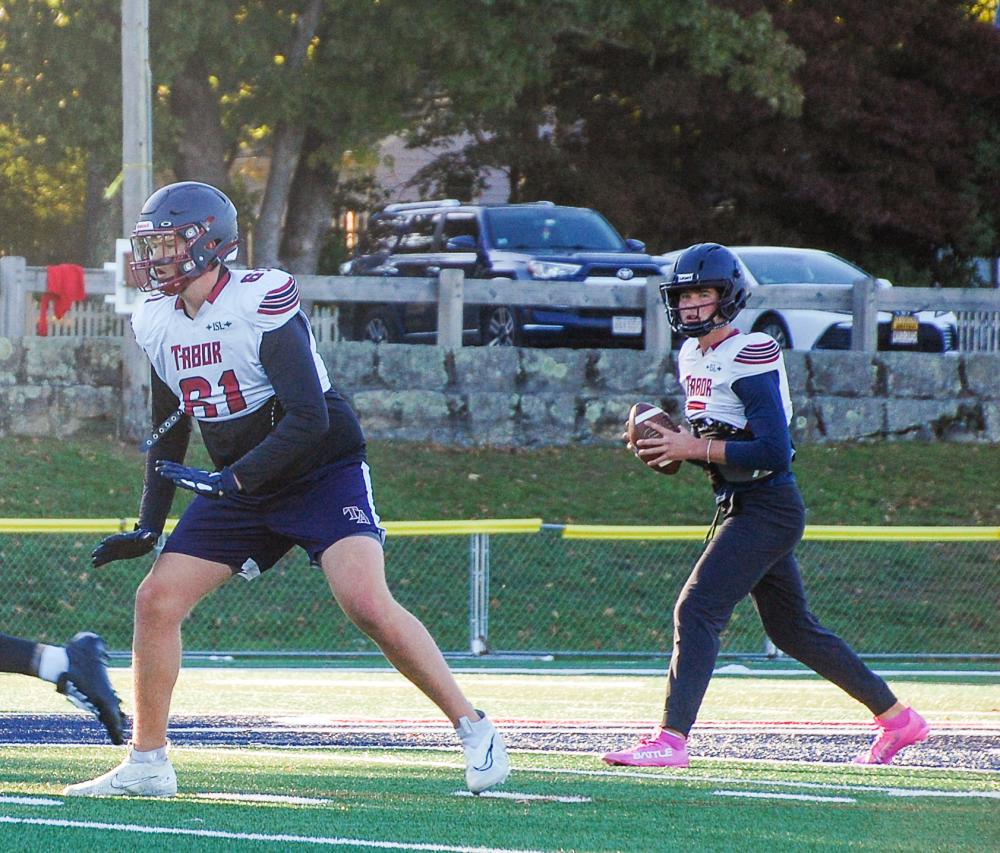 Bourque waits for a snap as Grady Holmes blocks for him. Bourque waits for a snap as Grady Holmes blocks for him.