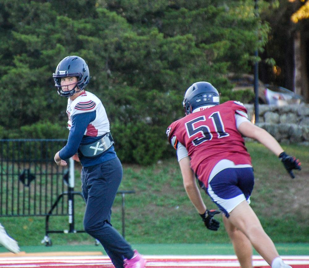 Bourque watches out for a oncoming sack. Bourque watches out for a oncoming sack.