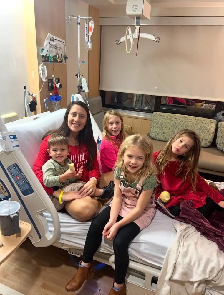Pease and her 4 children visiting in the hospital, December 5, 2024, the day Pease was diagnosed with MS.
