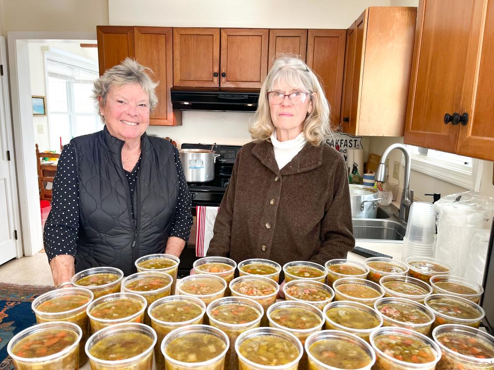 Meg Albert, left, and Patty Nicholson make a combined 80 quarts of soup for Damien's Food Pantry each week. Photo by : Grace Roche