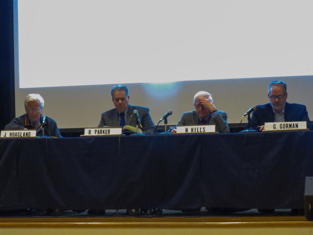 From left: Select Board members  John Hoagland, Norman Hills, Randy Parker and Town Administrator Geoffrey Gorman at the Special Town Meeting on Monday, March 23. Photo by Grace Roche