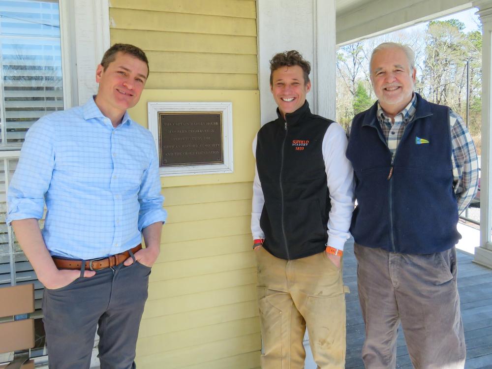 From left: Joshua Fischer, Gerry Riker and Will Tifft stand outside the Captain Hadley House. Photos by Grace Roche