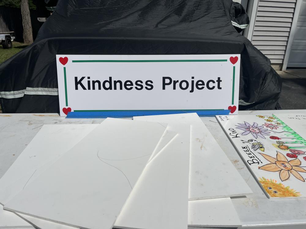 A table on Stan Bradford's property offers boards for people to decorate and return for his Kindness Project. Photos by Grace Roche