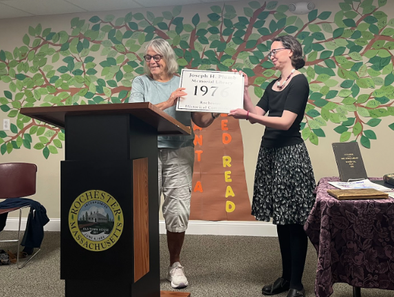 Library Director Kristen Cardoso accepts a plaque from the Rochester Historical Commission on Saturday, Aug. 22. Photo by Tanvi Kulkarni