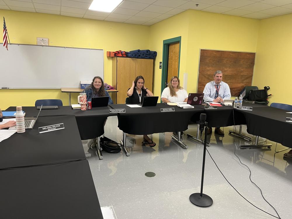From left: School Committee members Nichole Nye McGaffey, Nichole Daniel and April Nye, and Superintendent Michael Nelson at the Sept. 17 School Committee meeting. Photo by Grace Roche 