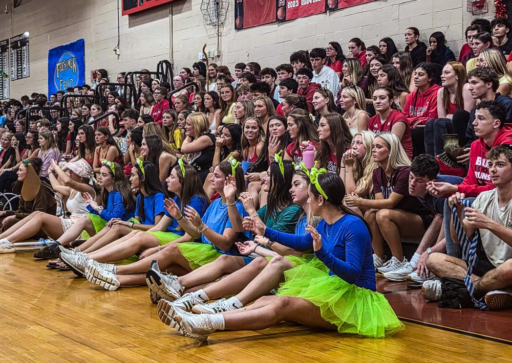 Senior students wave their hands in the air during their class skit, which had a "Toy Story" theme. Photos by Tanvi Kulkarni