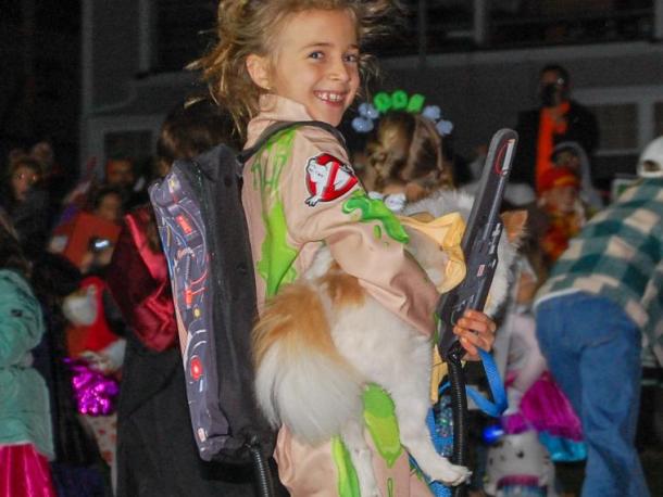 A Ghostbuster smiles with her ghostly-dressed dog. Photos by Mari Huglin
