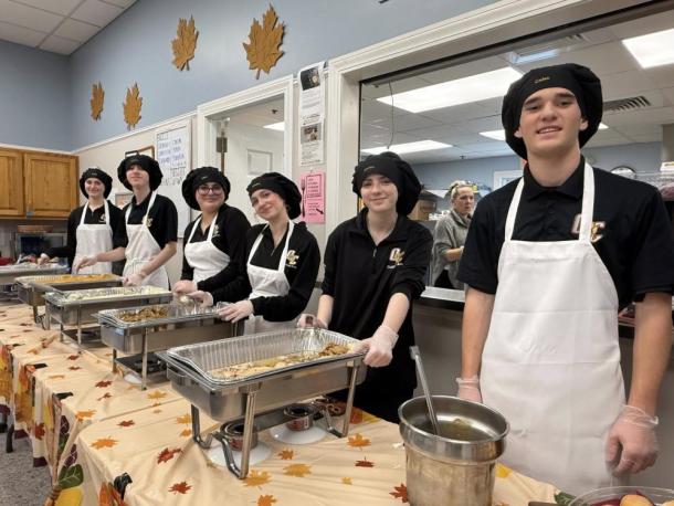 Old Colony students serve up delicious Thanksgiving fixings. 