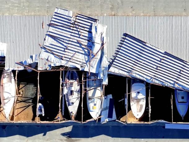 Roof of Triad Boatworks partially torn off in storm. Source: David Curran