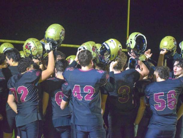 The team celebrates at the end of the game. 