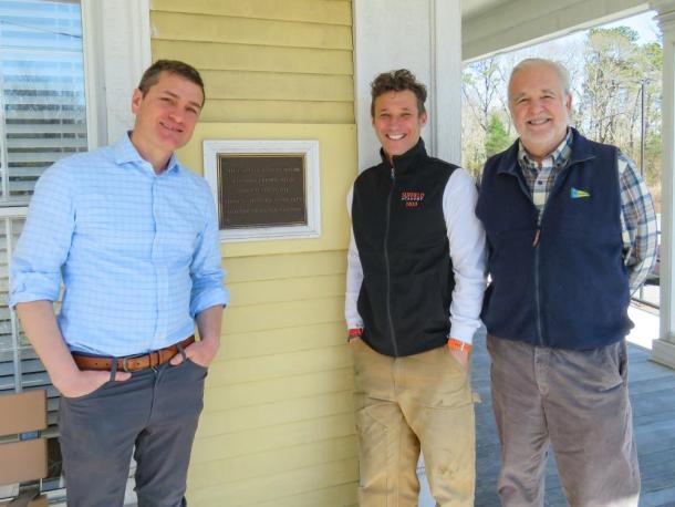 From left: Joshua Fischer, Gerry Riker and Will Tifft stand outside the Captain Hadley House. Photos by Grace Roche