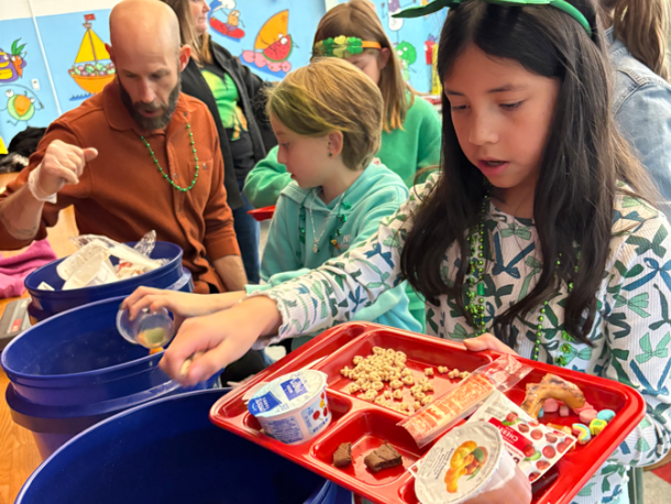 An Old Hammondtown School student sorts through food waste. Photo source: Marion Institute