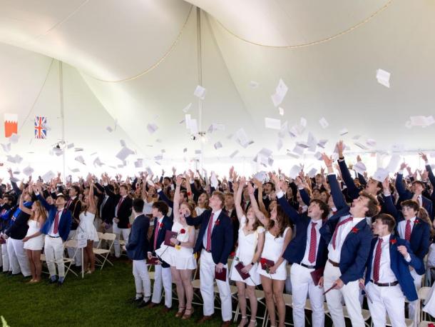 Graduates toss their commencement programs in the air at graduation on Friday, May 22. Photos source: Lawrence Films