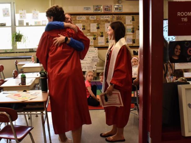 Senior Max Chace embraces his former teacher, Ashley Sweatland. Photos source: ORRHS