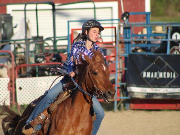 A rider rounds the barrels. Photos by Brandy Muz