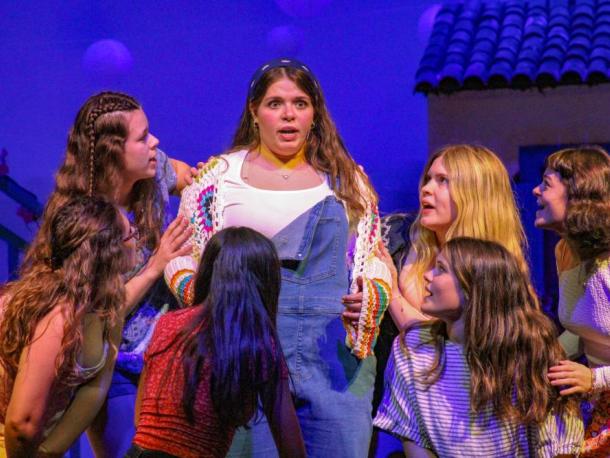 Amanda Tomasso, center, portrays Donna Sheridan in "Mamma Mia!" during a Monday, May 4 dress rehearsal at Old Rochester Regional High School. Photos by Grace Roche