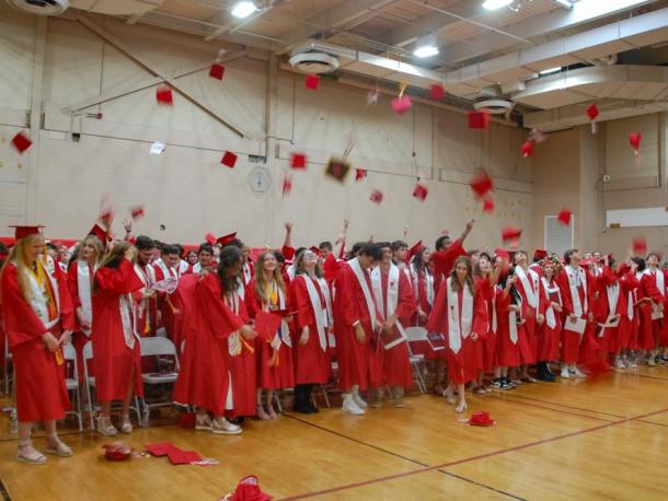 Graduating students toss their caps in the air at Old Rochester Regional High School's commencement on Saturday, May 30. Photos by Grace Roche